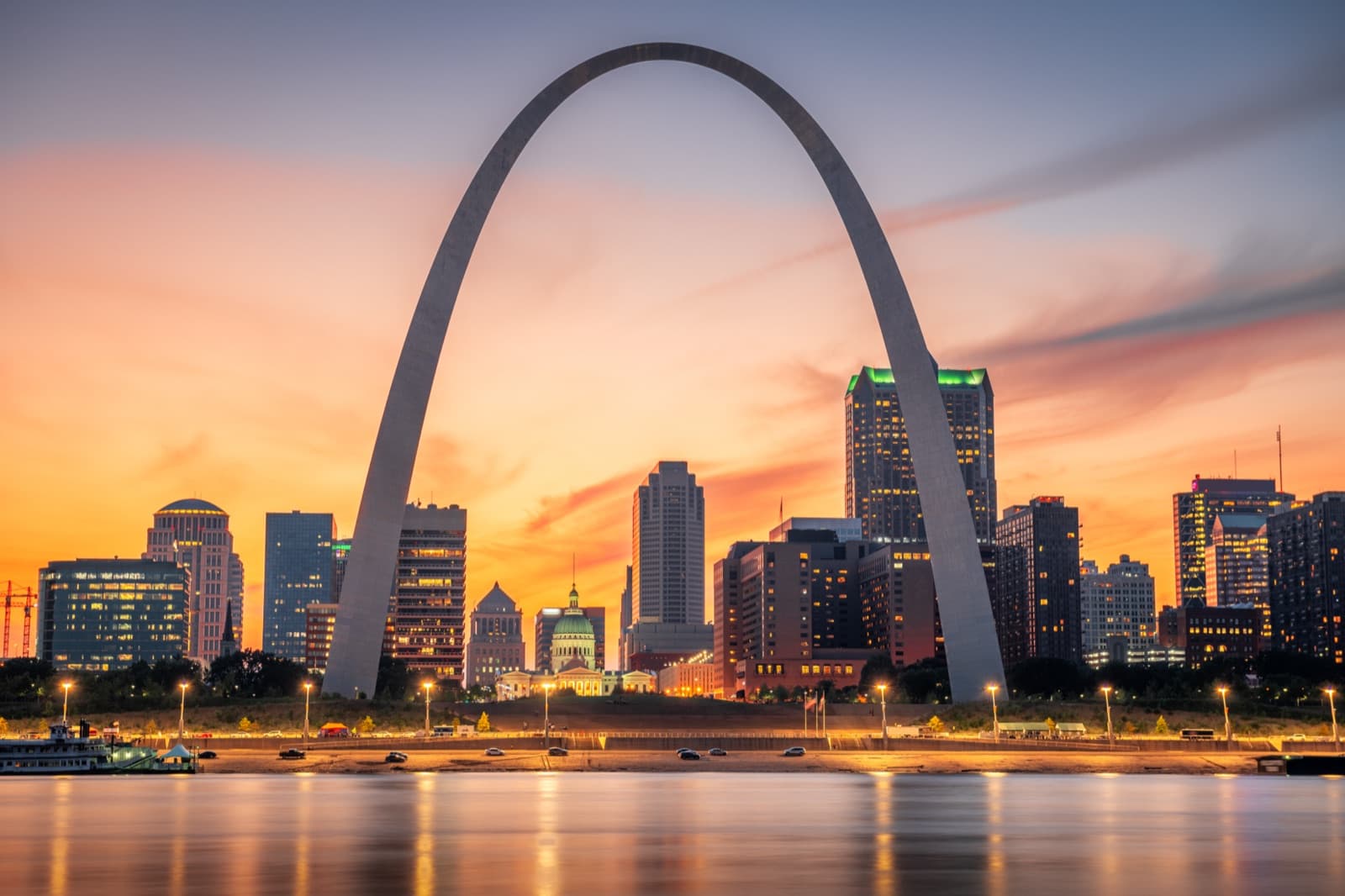 Gateway Arch and St. Louis, Missouri skyline at sunset over the Mississippi River